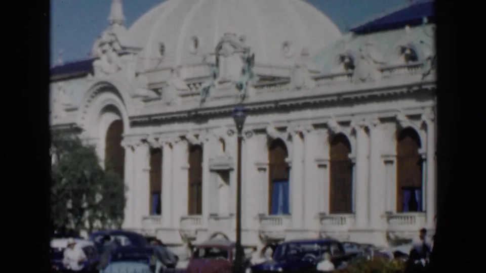 The final frame shows the pale domed building in Venice, Italy, with decorative arches, street lamps, and mid-century cars parked along the foreground.