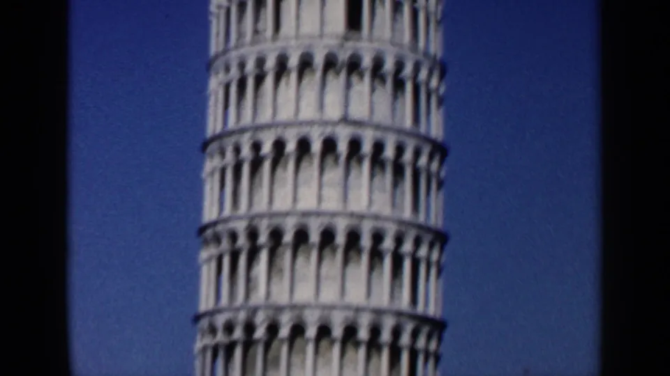1960 8mm frame showing the tower's lower and middle arched galleries, cropped by the home-movie camera frame.