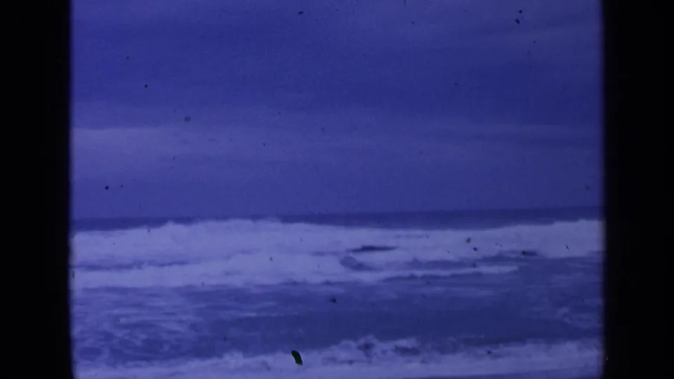 Rough Pacific surf appears in a 1963 8mm frame, with foamy wave bands and a steady horizon near San Francisco.
