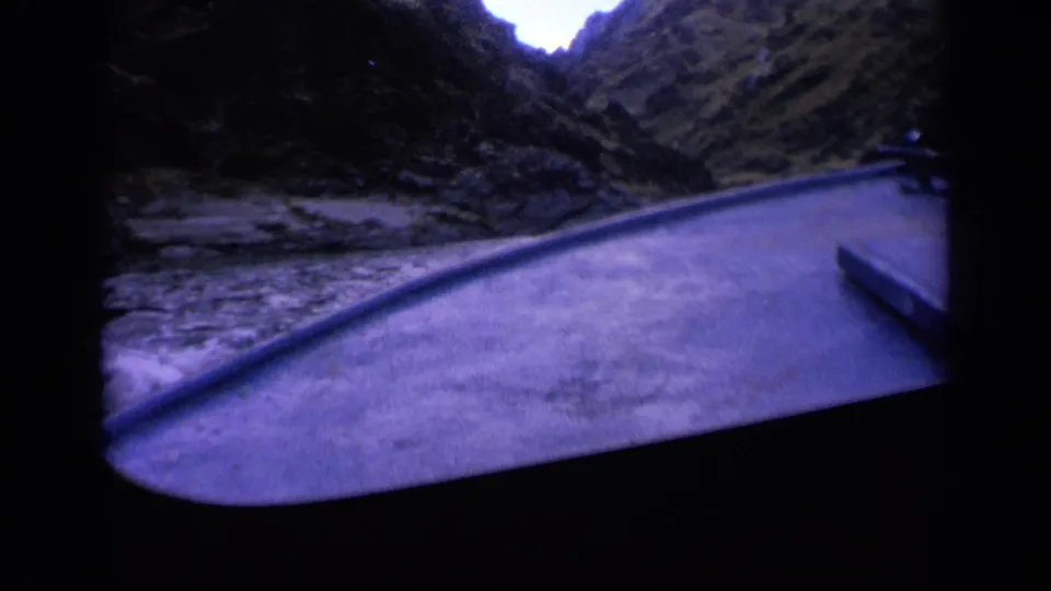 1963 Washington 8mm view from inside a boat traveling down a narrow river through a rugged mountain canyon.