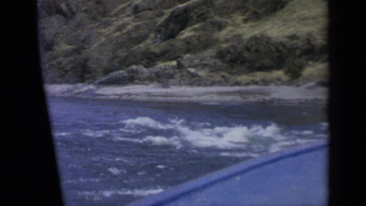 1963 Washington river footage shows white rapids and a rugged bank from a moving home-movie viewpoint.