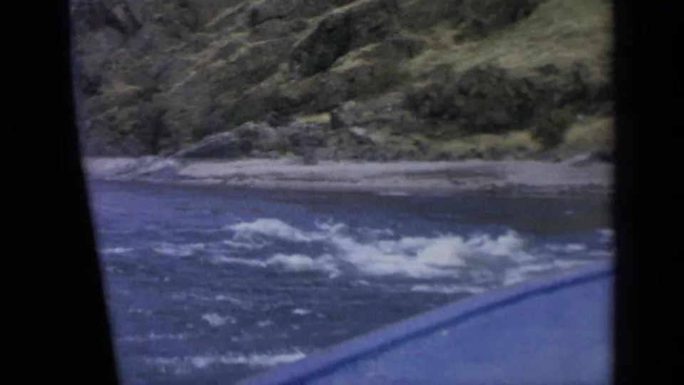 1963 Washington river footage shows white rapids and a rugged bank from a moving home-movie viewpoint.