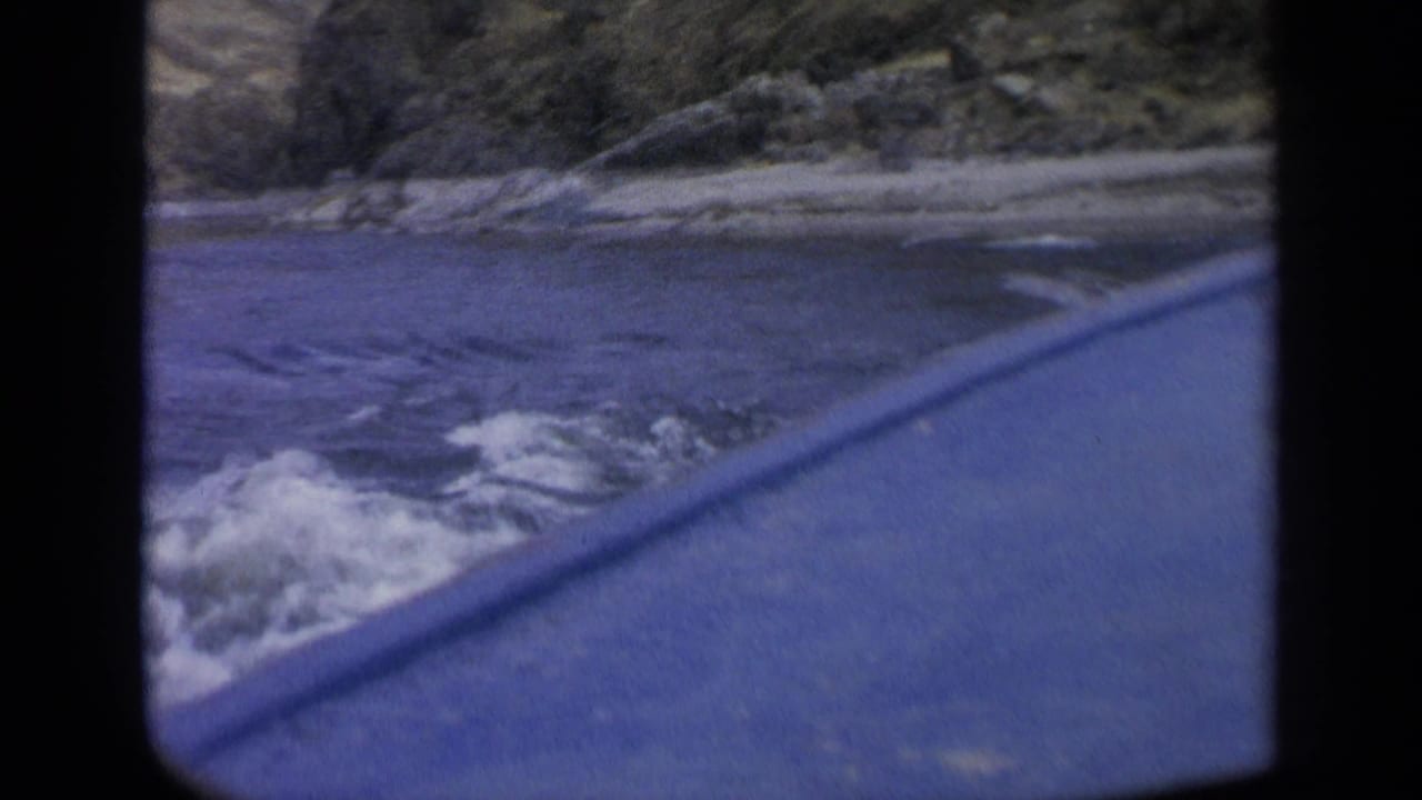 The final 1963 Washington frame shows rapids, a pale shoreline, and hillside terrain from a moving travel perspective.