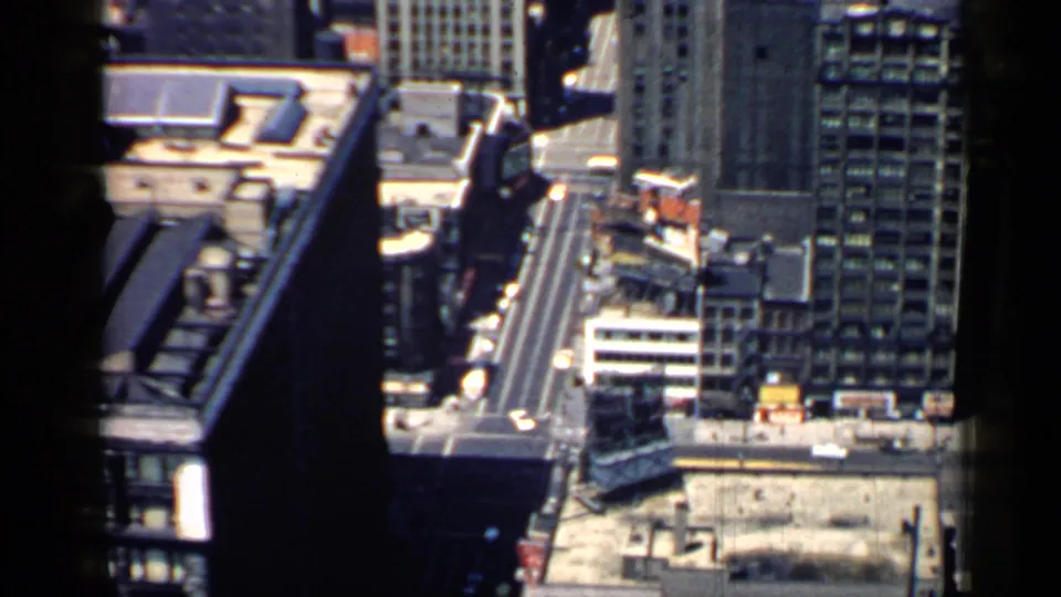 1957 Chicago downtown view looking down across rooftops, streets, and tall commercial buildings.