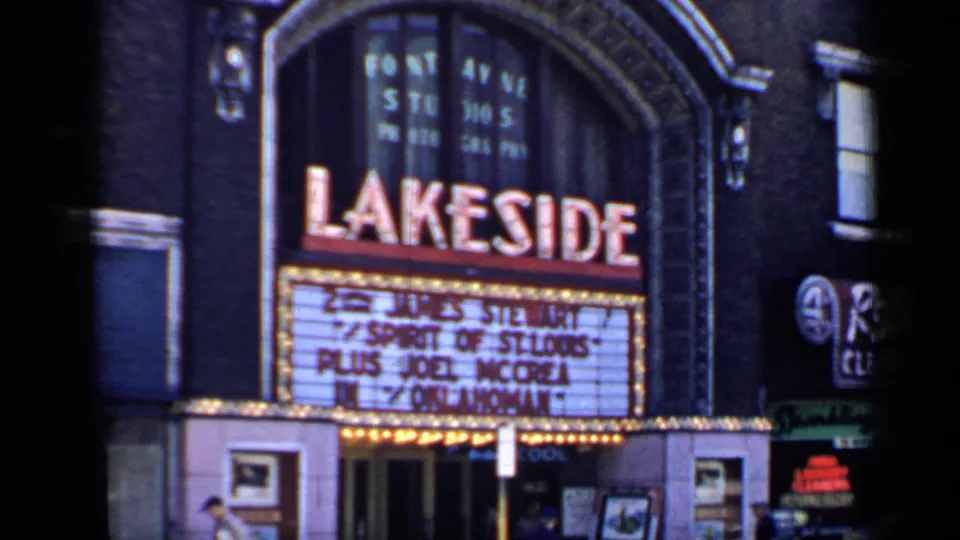 Lakeside Theatre facade in Chicago with marquee lettering for period film titles and poster cases near the entrance.
