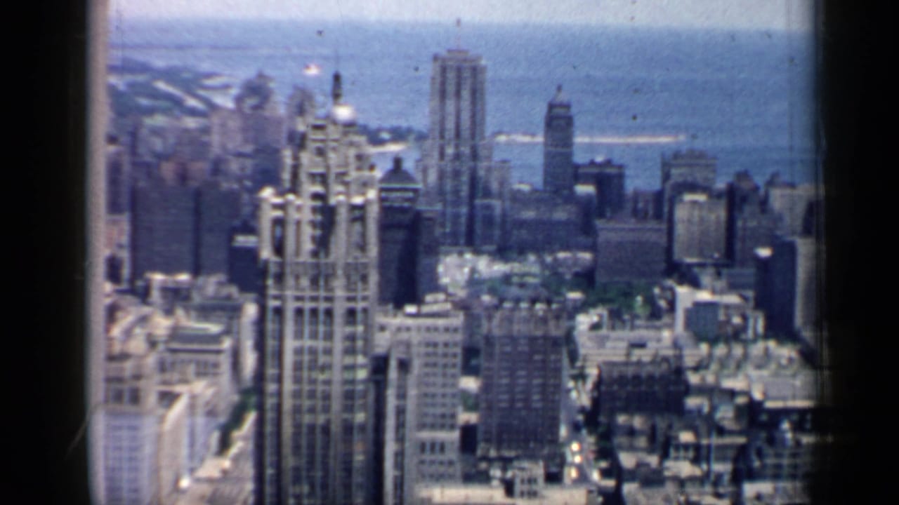 Aerial view of downtown towers with Lake Michigan in the background.