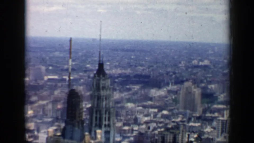 1958 Chicago skyline view with prominent spired towers in the foreground and the city stretching into haze.