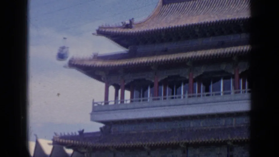 1964 home-movie view of layered rooflines and upper windows on the Chinese-style pavilion at Flushing Meadows.
