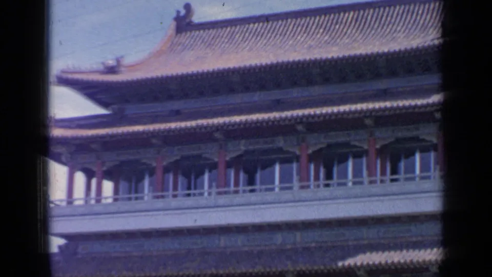 Close 1964 Flushing Meadows view of the Chinese-style pavilion roofline, upper windows, red supports, and painted trim.