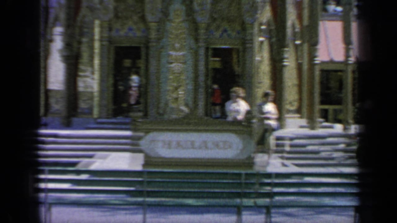 Thailand Pavilion entrance with steps, columns, visitors, and a THAILAND sign.