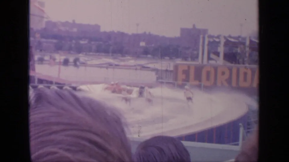 1964 World's Fair water-ski show at Flushing Meadows, with a large Florida sign visible behind the pool.