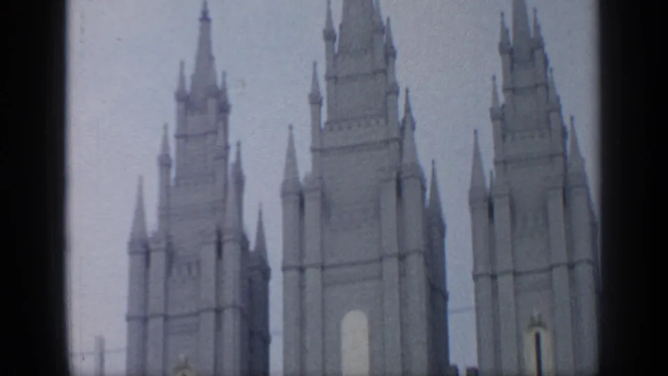 1964 Flushing Meadows frame showing several spired towers rising above the frame with soft 8mm color and grain.