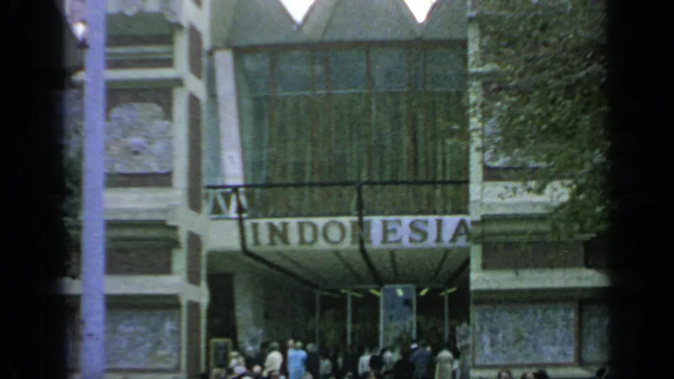 Entrance to the Indonesia Pavilion at the 1964 New York World's Fair, with the country name sign above visitors at the doorway.