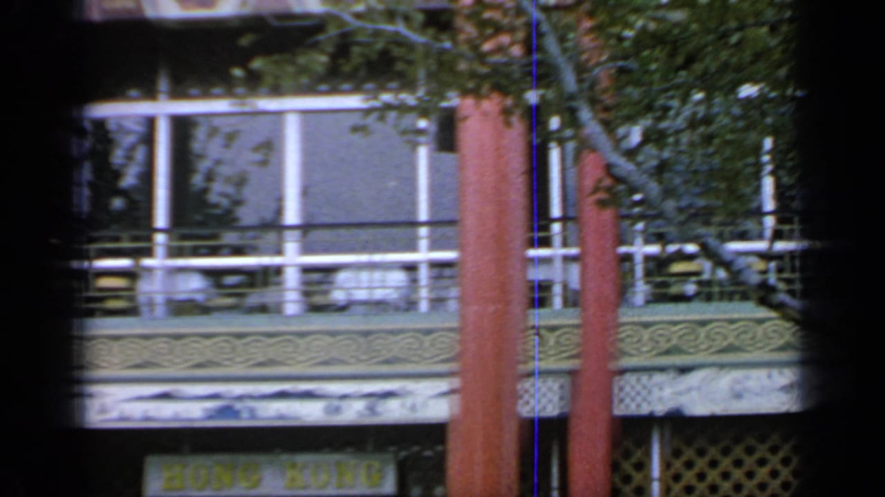 Hong Kong Pavilion facade partly obscured by trees and film gate edges.