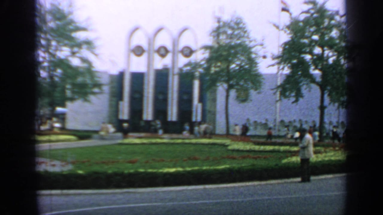 Visitors move along paths beside the U.A.R. arches at Flushing Meadows during the 1964 New York World's Fair.