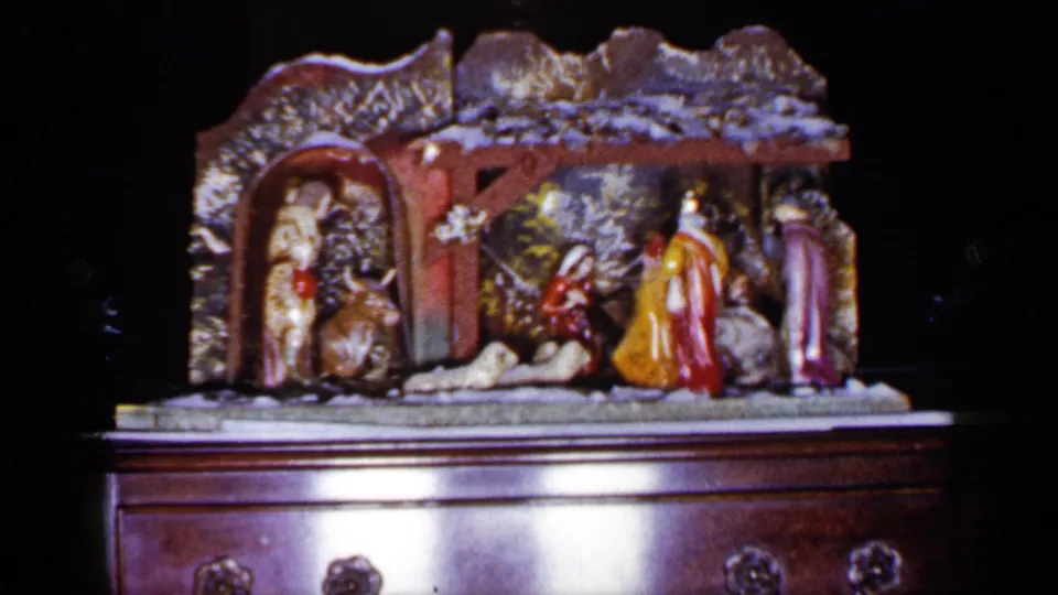 1965 Long Island home-movie still showing the manger scene from a slightly lower, closer view on the cabinet.
