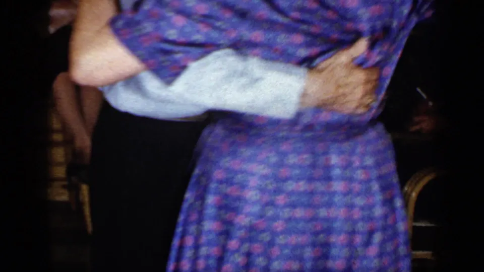 The 1965 Long Island home movie shows the couple from another angle as they hold each other and dance in the wood-paneled room.