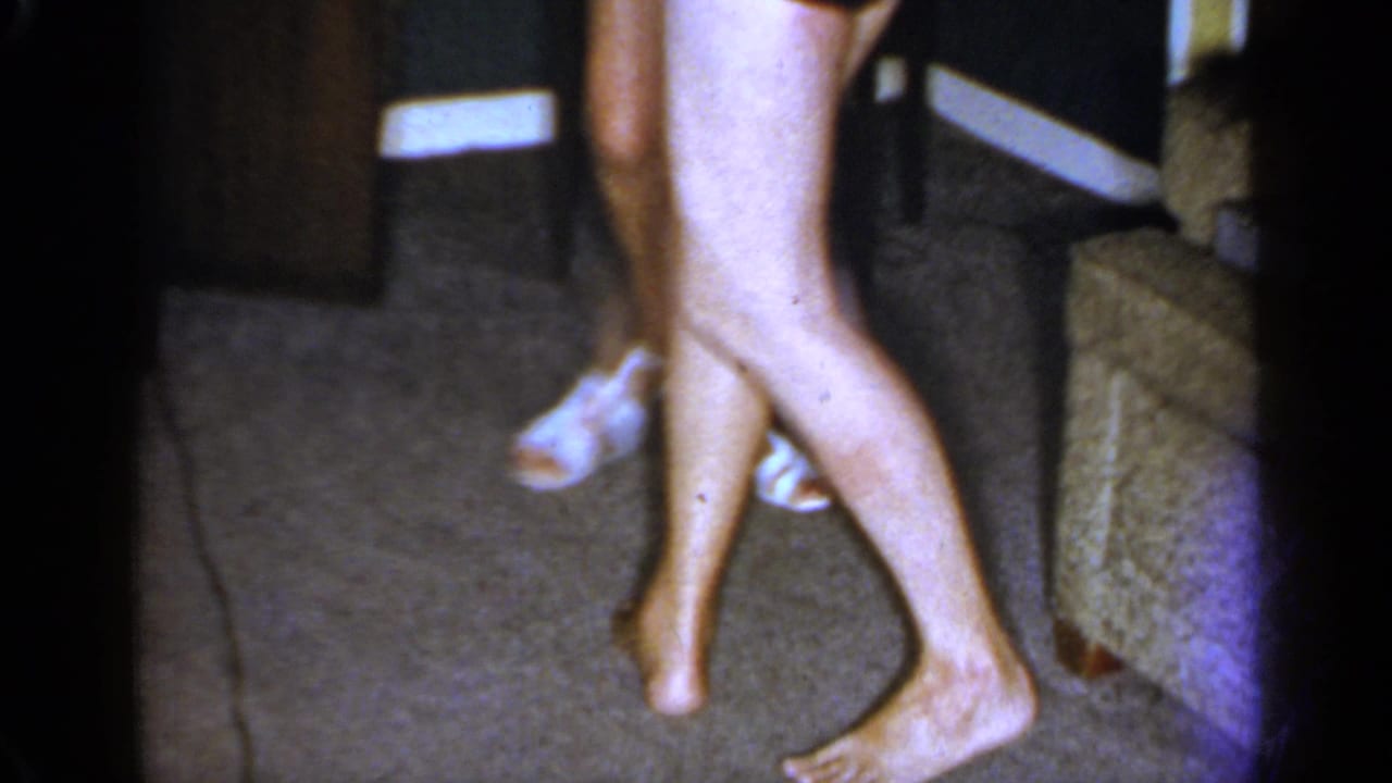 A close, low 1966 Mineola view shows adults dancing near steps, with sandals and bare feet visible.