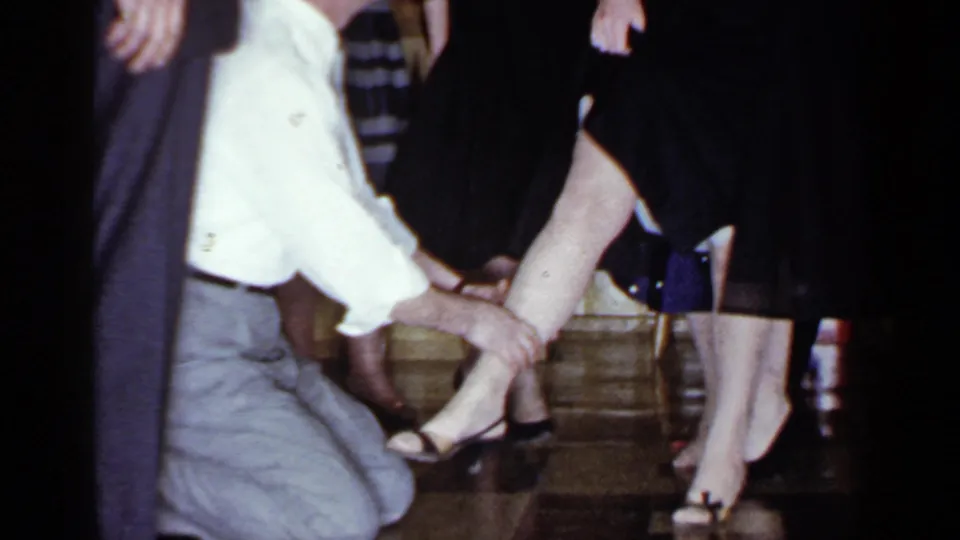 The blindfolded man touches a woman's lower leg during a 1966 indoor party game in Mineola, New York.
