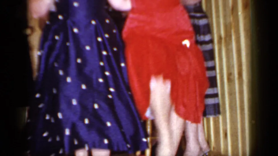 The 1966 home movie shows women dancing close to the camera in a wood-paneled Mineola party room.