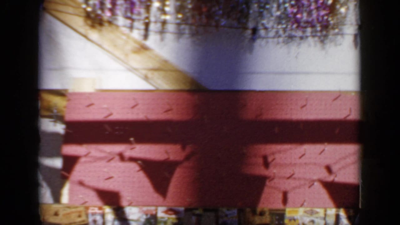 Carnival booth wall and hanging decorations with no central player visible.