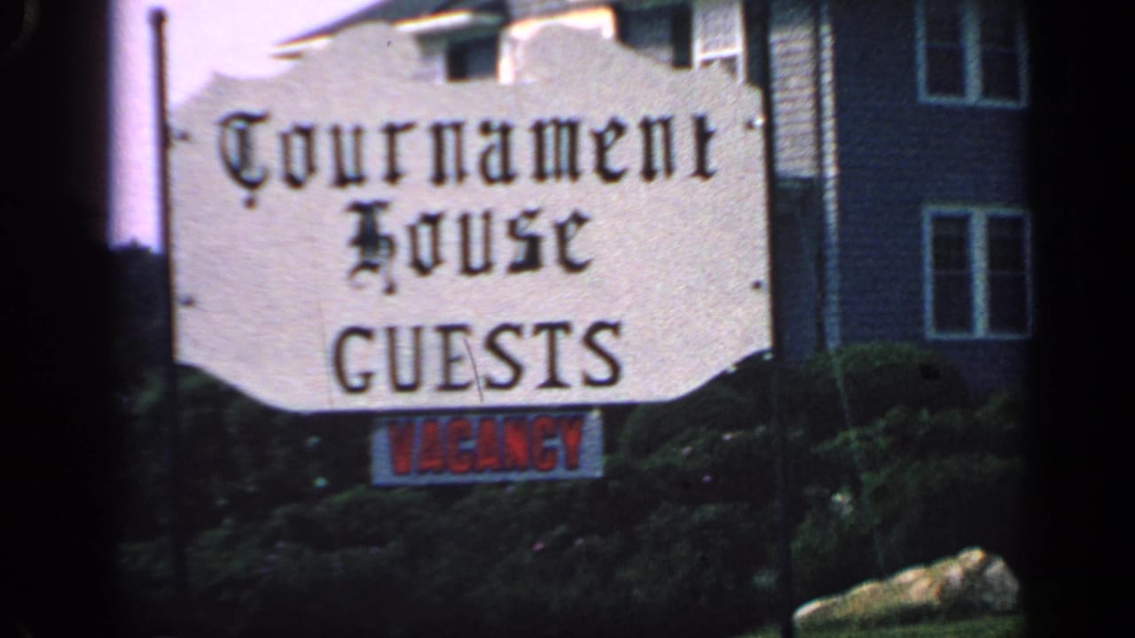 Tournament House guests sign with red vacancy notice below it.
