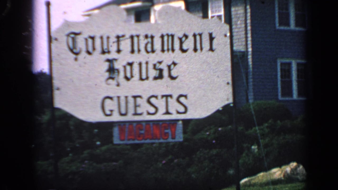 Guesthouse sign reading Tournament House GUESTS with vacancy lettering below.