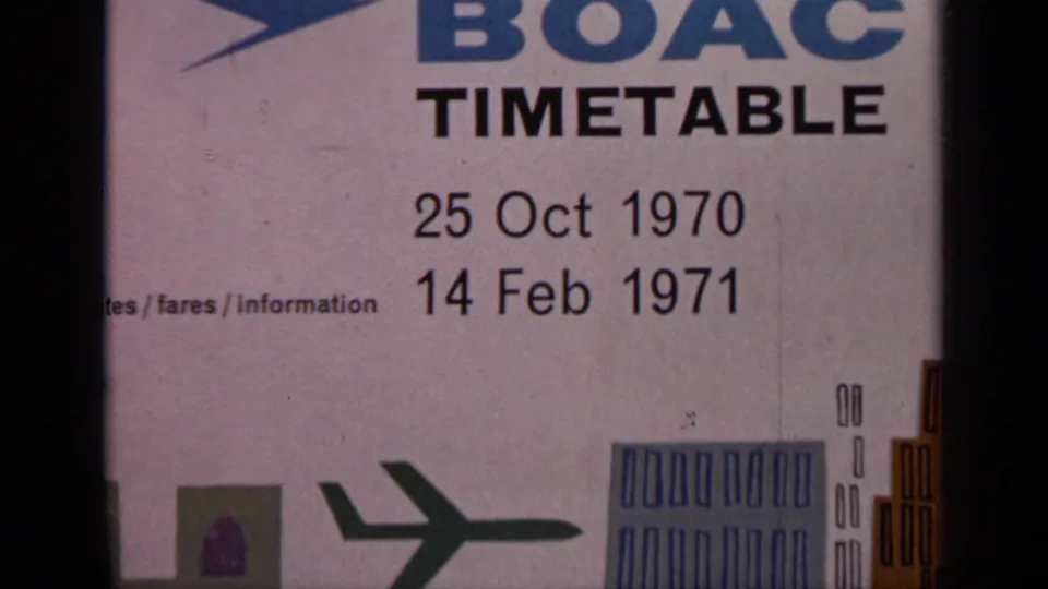 Close 8mm frame of a BOAC timetable cover showing the 1970 to 1971 date range and printed travel graphics.