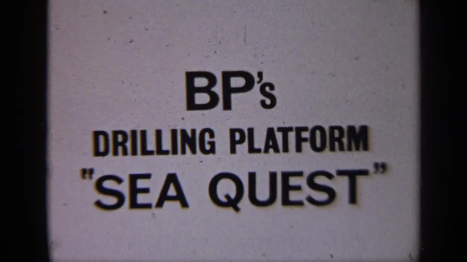 1970 United Kingdom 8mm frame showing a BP drilling platform Sea Quest title card on a pale background.