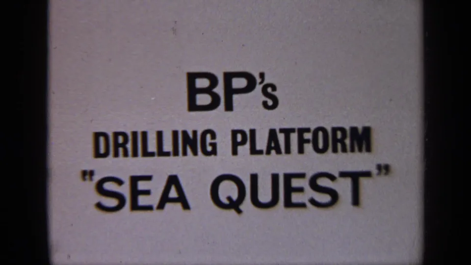 1970 United Kingdom frame of the BP Sea Quest drilling platform title card, with soft 8mm grain and dark gate edges.