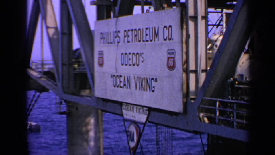 1970 United Kingdom 8mm frame showing Phillips Petroleum Co., ODECO, and Ocean Viking signage on an offshore rig structure.