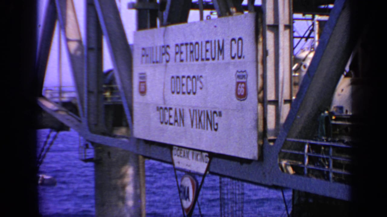 Rig sign with Phillips Petroleum Co. and Ocean Viking text beside steel supports.