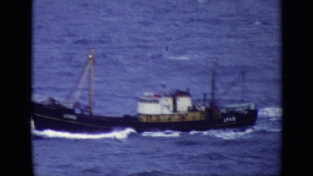 1970 United Kingdom Super 8 frame showing the LT425 trawler broadside as it rides through choppy sea.