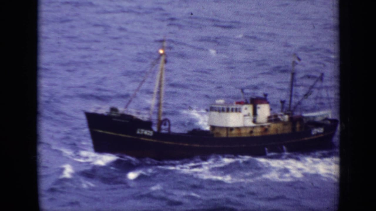 Side view of trawler LT475 on rough blue water.
