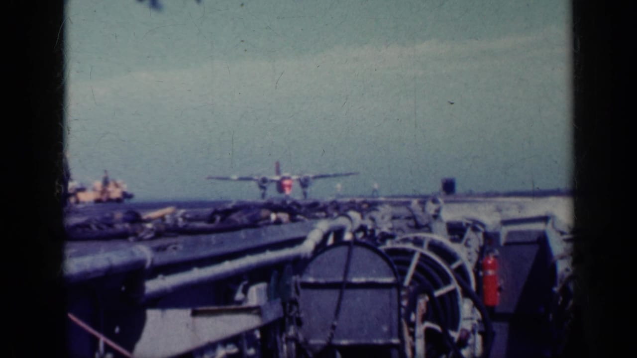 Military aircraft approaching or lifting from an aircraft carrier deck at sea.