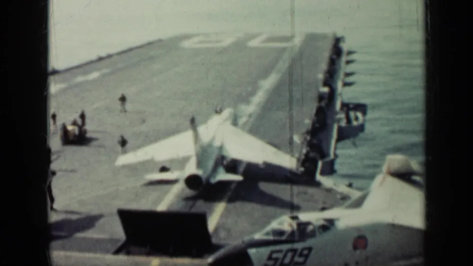 1962 Cuba metadata supports this view of a military jet preparing on an aircraft carrier deck, with crew nearby and aircraft 509 partly visible.
