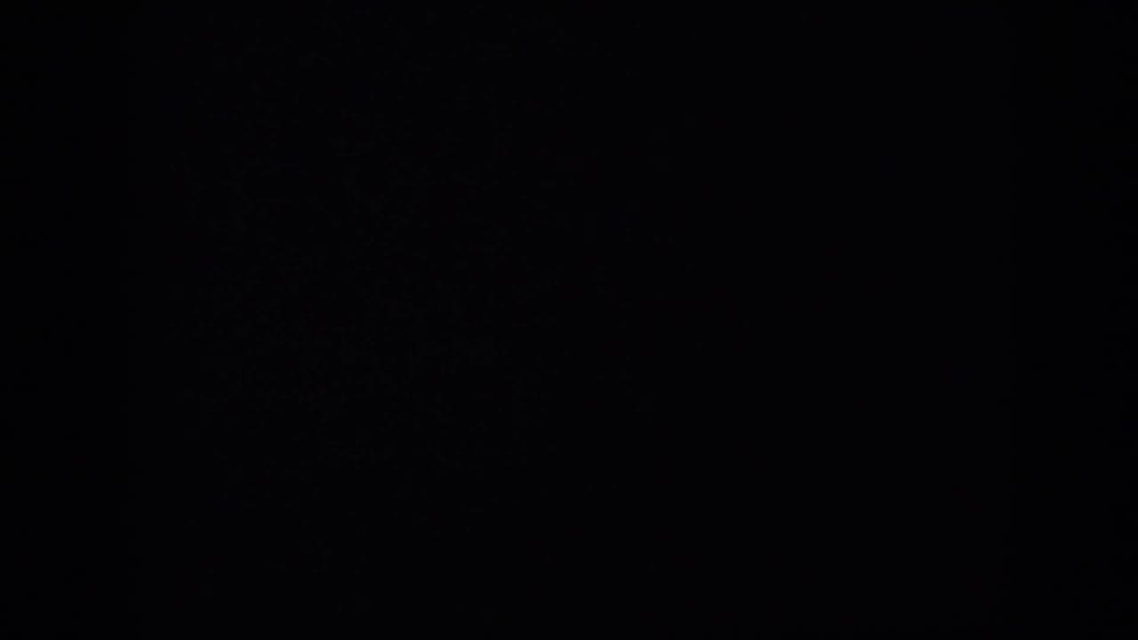 A mostly black 8mm contact-sheet frame with only faint film texture visible, likely before or between exposed deck footage.