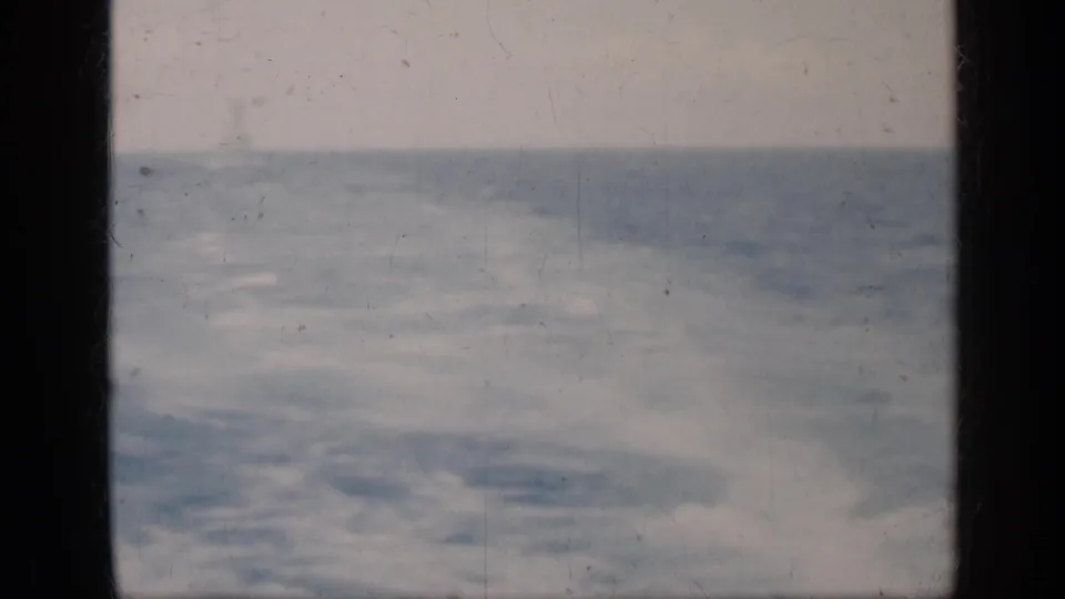 1962 Cuba 8mm home-movie view of choppy ocean under a pale sky, framed by dark film borders.