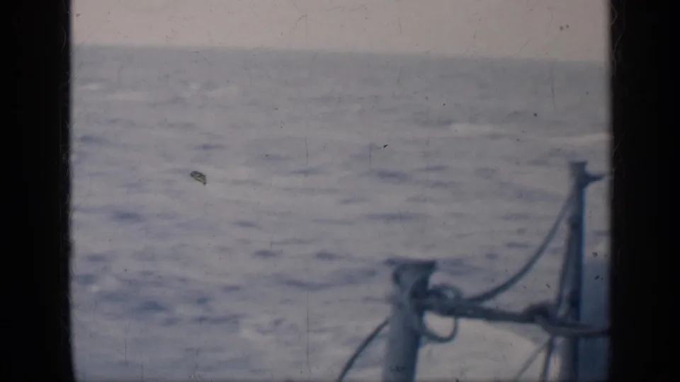 1962 Cuba 8mm view across open sea, with boat railing or rigging entering the lower-right corner.