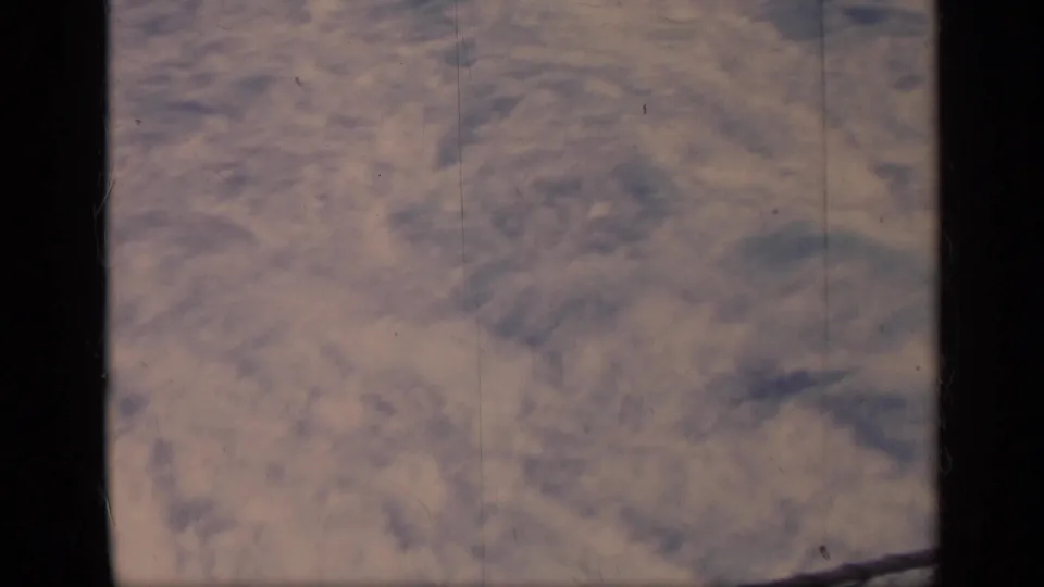 1962 Italy 8mm frame with soft, blurred boat wake and rippled water inside visible film borders.