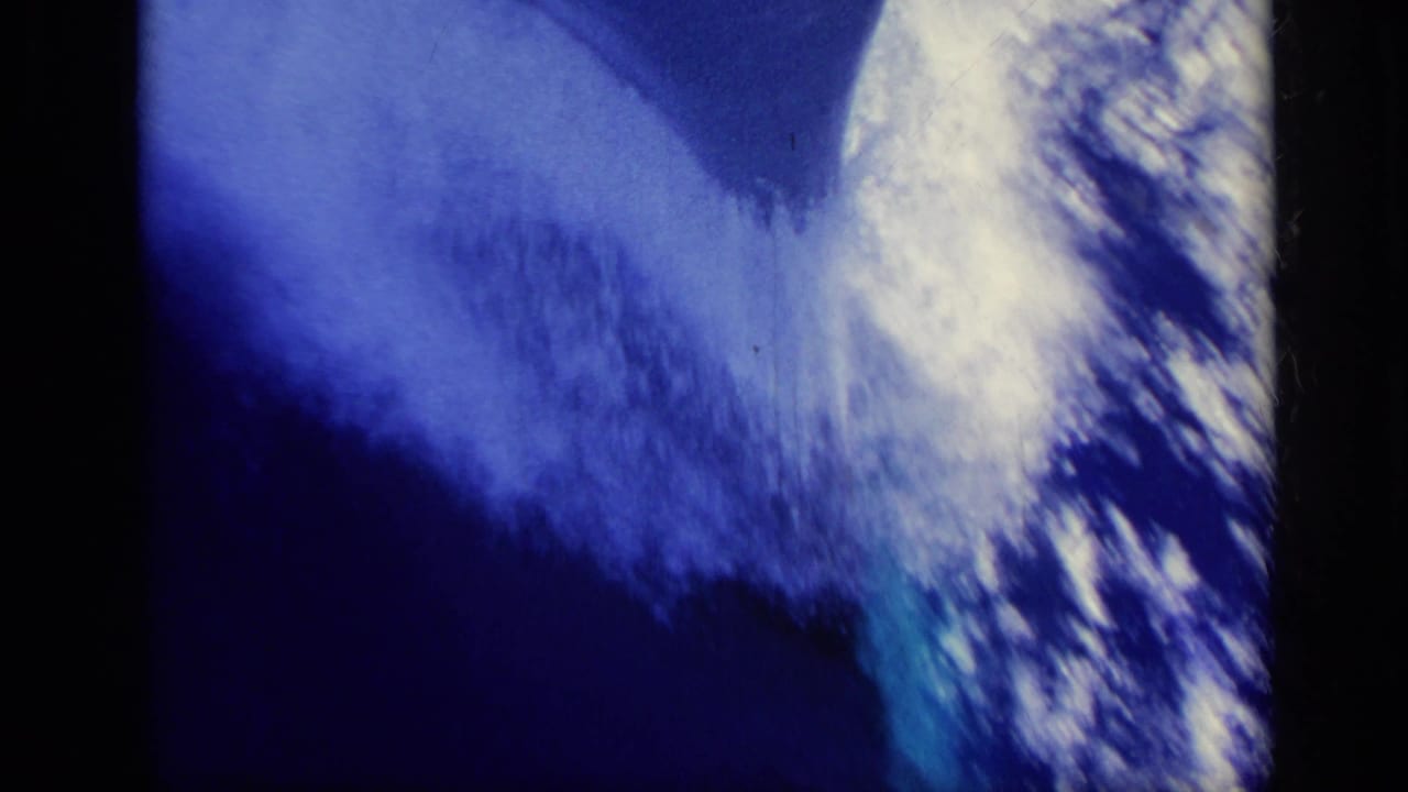 Foamy wake spreads through deep blue water in this 1962 Italy 8mm maritime shot.