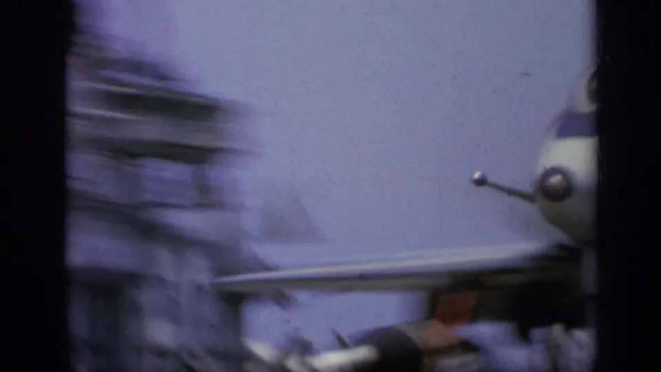 End frame from 1962 Italy footage showing heavy motion blur as an aircraft passes near the camera on the carrier deck.
