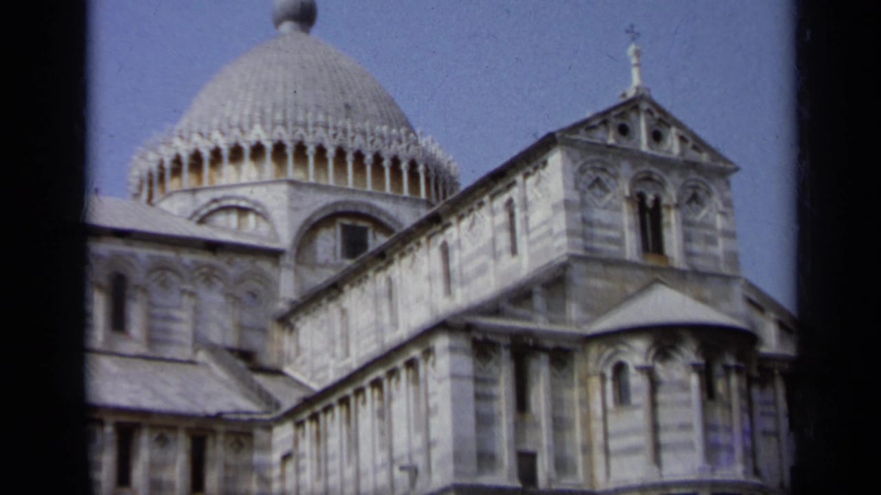 Cathedral dome and side elevation with arched windows and striped marble walls.