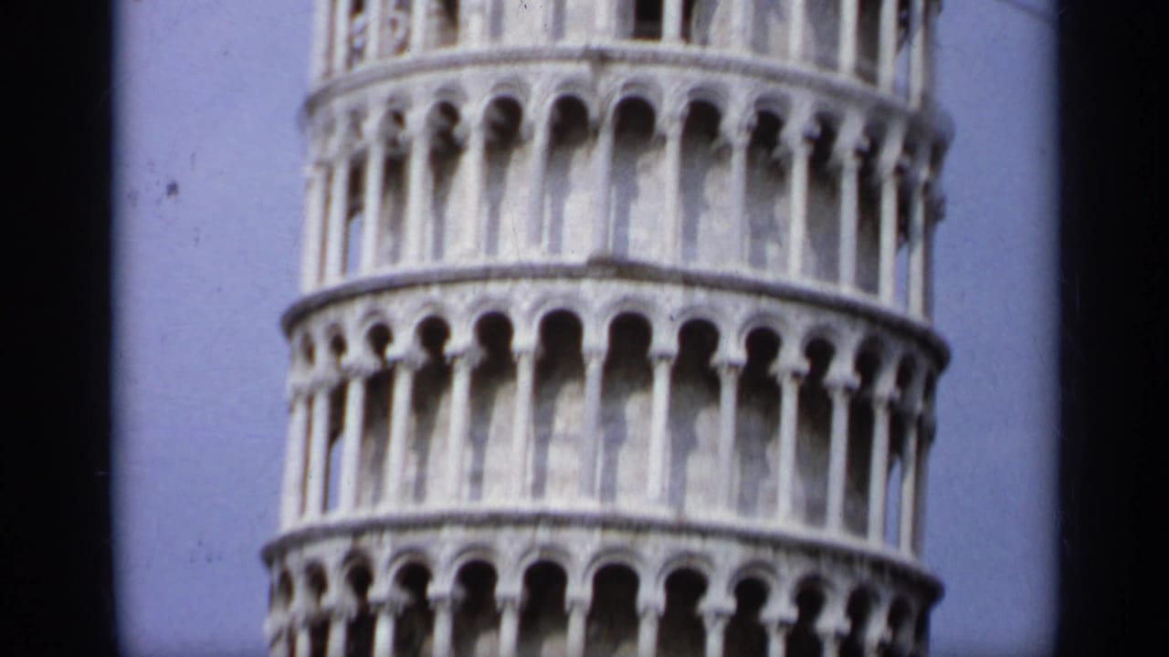 Close view of the Leaning Tower of Pisa's arched stone levels.