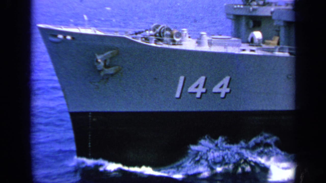 Gray U.S. Navy ship bow at sea with hull number 144 visible.