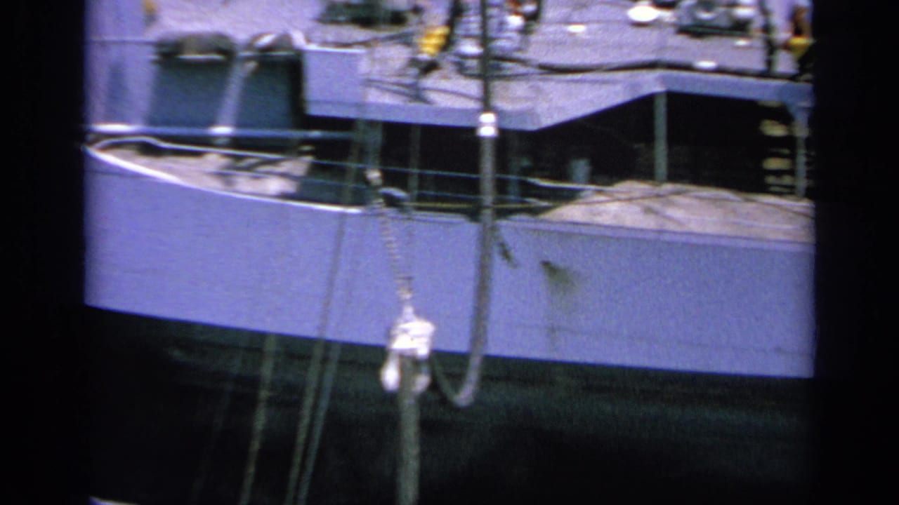 1963 Greece 8mm view of a naval ship superstructure at port, with railings, rigging and deck details visible.