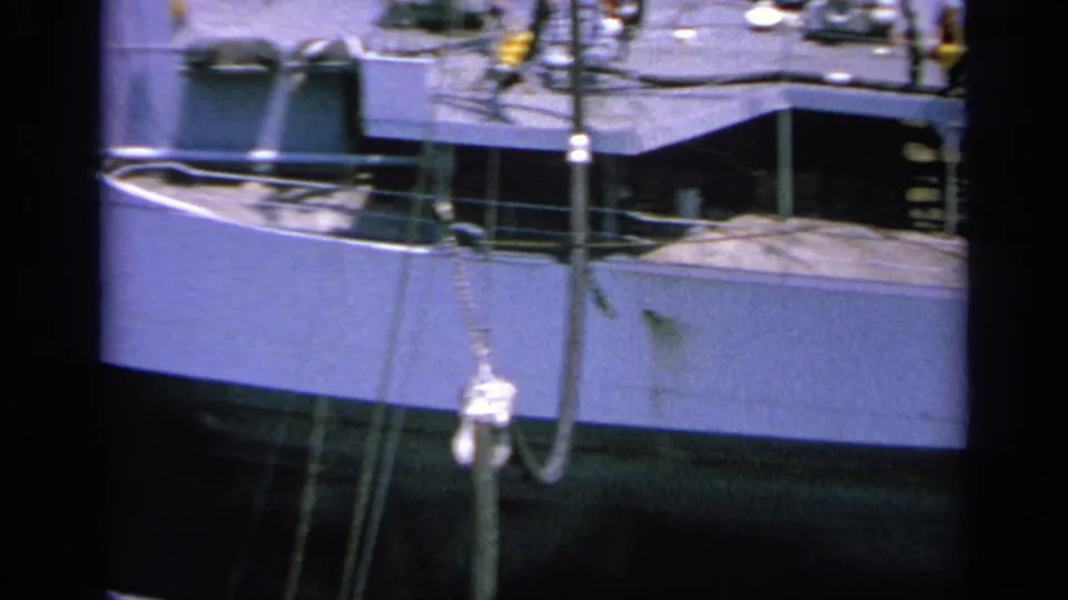 1963 Greece 8mm view of a naval ship superstructure at port, with railings, rigging and deck details visible.