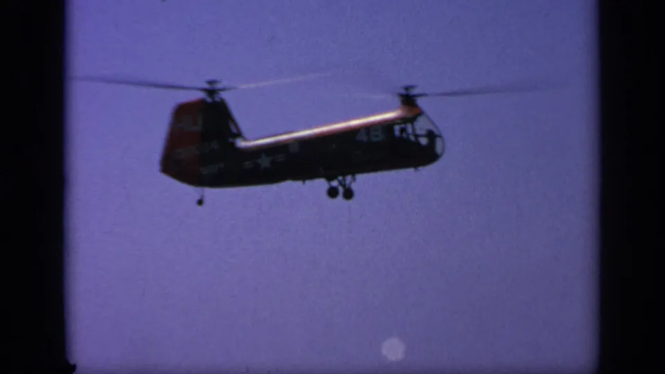 1963 Greece frame showing a military helicopter in profile, with visible numbers and insignia-like markings on its fuselage.