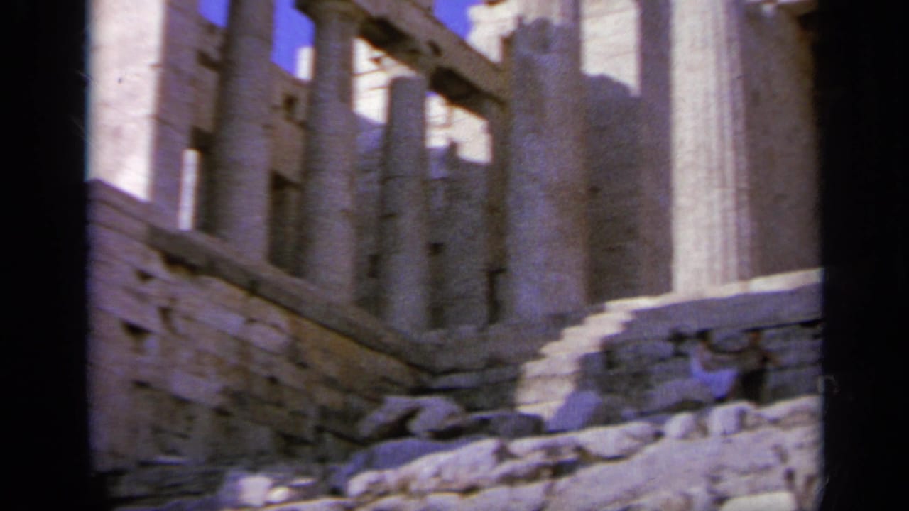 1963 Greece footage shows stone steps, columns, and partial walls within an ancient ruin complex.