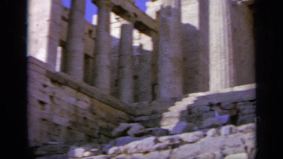 1963 Greece footage shows stone steps, columns, and partial walls within an ancient ruin complex.
